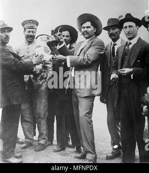 Francisco 'Pancho' Villa, born Doroteo Arango Arambula (1878-1923), Mexican Revolutionary General. Villa, second left in military cap, with Raul Madero, c1923, Villa was ambushed and assassinated on 20 July 1923. Stock Photo