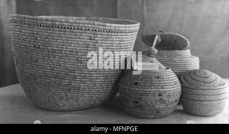 Group of Native American Indian baskets, some with lids. Twentieth century 20th century Stock Photo