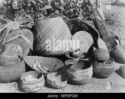 Group Karok baskets some with decoratvie woven patterns and some with lids, c1923.  Native American Indian. Photograph by Edward Curtis (1868-1952). Stock Photo