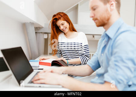 Colleagues working studying in white office Stock Photo