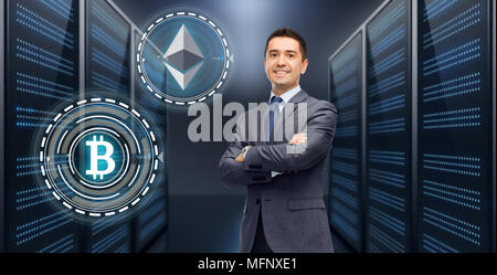 businessman with cryptocurrency holograms Stock Photo