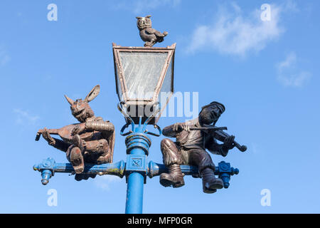 Ornate cast iron lamp post against a blue sky, Stratford upon Avon, Warwickshire, West Midlands, U.K. Stock Photo