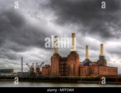 Battersea power station against a dark stormy sky before local develoments changing the iconic skyline Stock Photo