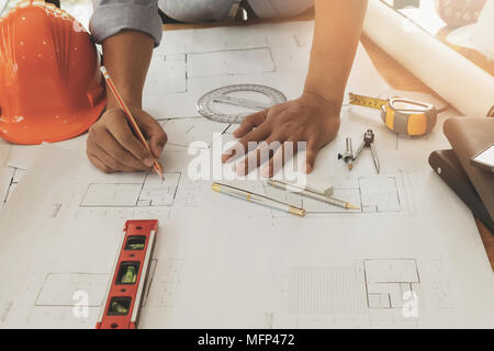 Architect or engineer working on blueprint, architectural concept Stock Photo