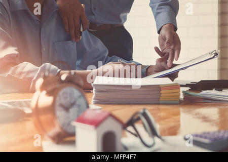 Business team meeting and discussing project plan. Businessmen discussing together in meeting room. Professional investor working with business projec Stock Photo