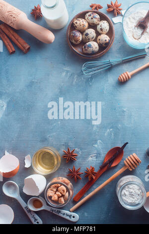 Baking tools and ingredients on a textured concrete background. Cooking utensils flat lay with copy space. Modern kitchen concept Stock Photo