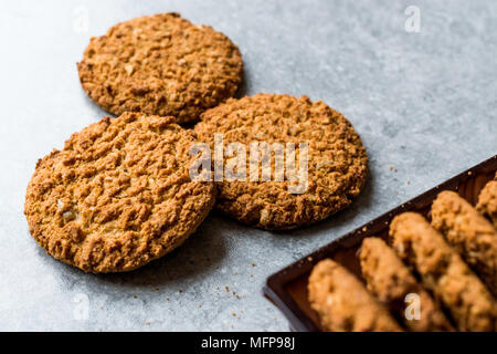 Oatmeal Cookies made with sesame, fig, cinnamon, peanut and sunflower seeds. Organic Food. Stock Photo