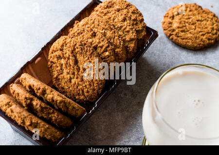 Oatmeal Cookies made with sesame, fig, cinnamon, peanut and sunflower seeds and milk. Organic food. Stock Photo