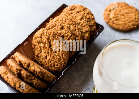 Oatmeal Cookies made with sesame, fig, cinnamon, peanut and sunflower seeds and milk. Organic food. Stock Photo