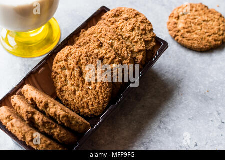 Oatmeal Cookies made with sesame, fig, cinnamon, peanut and sunflower seeds and milk. Organic food. Stock Photo