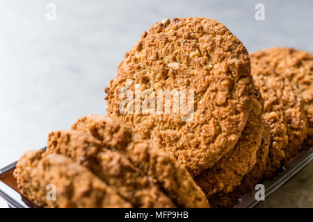 Oatmeal Cookies made with sesame, fig, cinnamon, peanut and sunflower seeds. Organic Food. Stock Photo