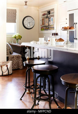 Bar stools at breakfast bar in modern kitchen, New Jersey, USA Stock Photo