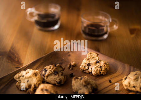 Chocolate Chip Cookies with the coffee on a wooden surface. Stock Photo