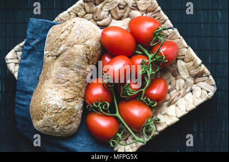 Tasty food on wicker plate Stock Photo