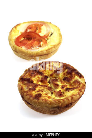 Leek Quiche and Tuna Quiche with Tomatoe against White Background Stock Photo