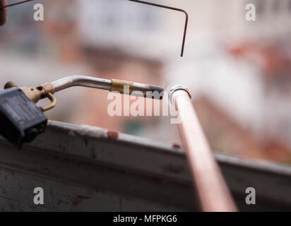 Welding of copper pipe of a methane gas pipeline or of a conditioning or water system. Stock Photo