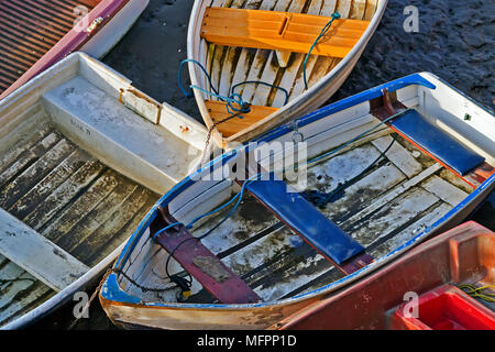 A collection of small and neglected rowing boats in need of some tender loving care! Stock Photo