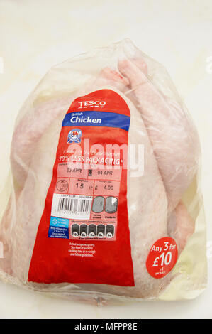 Fresh chicken with 70% less packaging & the assured food standards association British logo the little red tractor symbol Stock Photo