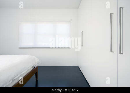 Contemporary White Bedroom With Built In Wardrobe And Black