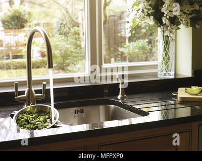 Extractor fan above gas hob in modern kitchen Stock Photo