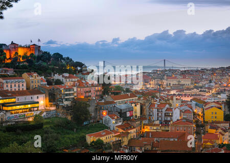 Lisbon cityscape, view across the rooftops of the Mouraria in the center of Lisbon towards the River Tagus and the Ponte 25 de Abril bridge, Portugal.