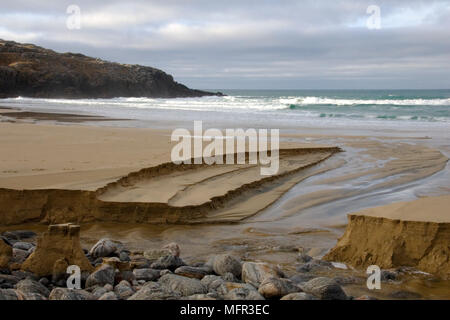 Outgoing tide creating erosion in the sand on the beach at Dahl Mor Isle of Lewis, Outer Hebrides, Scotland. Stock Photo