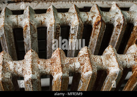 Old cast-iron battery. Vintage rusty battery section Stock Photo