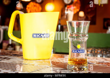 MARSEILLE, FRANCE - MARCH 15, 2018: Close of on a Ricard jug and a water bottle with its logo. Ricard is a pastis, an anise and licorice flavored aper Stock Photo