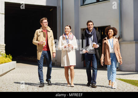 office workers with coffee on city street Stock Photo