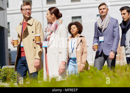 office workers with coffee on city street Stock Photo