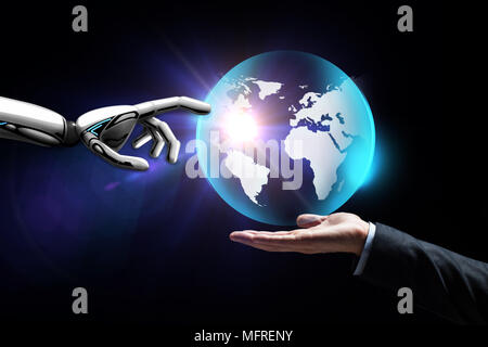 human and robot hand with virtual earth hologram Stock Photo