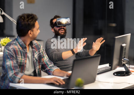 developers with virtual reality headset at office Stock Photo