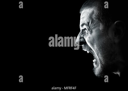 Scream of angry man with mad face expression Stock Photo