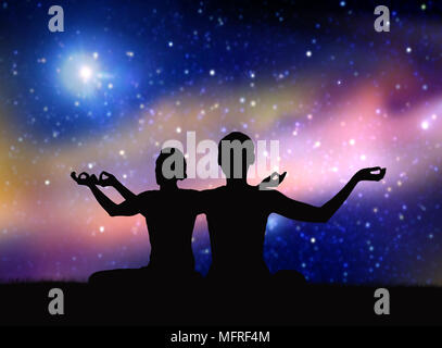 black silhouette of couple meditating over space Stock Photo