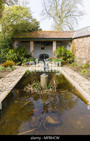 The Italian garden with it's pool and decorative fountain in the Lost Gardens of Heligan Cornwall Stock Photo
