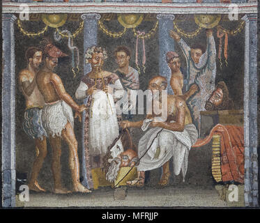 Choregos and theatre actors depicted in the Roman mosaic from the tablinum of the Casa del Poeta Tragico (House of Tragic Poet) in Pompeii, now on display in the National Archaeological Museum (Museo Archeologico Nazionale di Napoli) in Naples, Campania, Italy. Flute player and actors wearing goat skin costumes getting ready for a performance are depicted in the mosaic. Stock Photo
