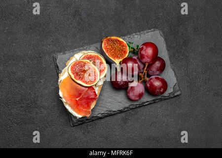 Bruschetta with ham, blue ceese and fresh figs Stock Photo