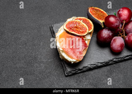 Bruschetta with ham, blue ceese and fresh figs Stock Photo