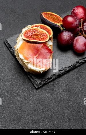 Bruschetta with ham, blue ceese and fresh figs Stock Photo