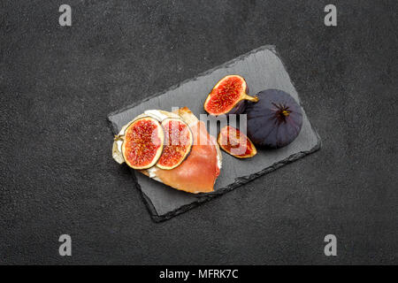 Bruschetta with ham, blue ceese and fresh figs Stock Photo