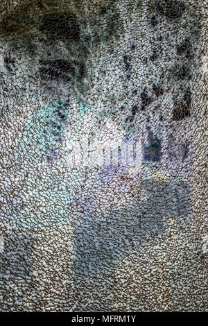 Broken tempered glass texture on a dark background Stock Photo