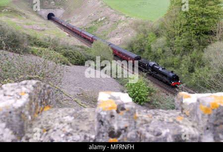 A 1920s Southern Railway 'U' class steam locomotive No. 31806, known as 'Mogul', hauls an excursion train between Dorchester and Weymouth in Dorset, as it makes it's way from Yeovil to Swanage. Stock Photo