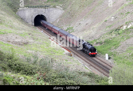 A 1920s Southern Railway 'U' class steam locomotive No. 31806, known as 'Mogul', hauls an excursion train between Dorchester and Weymouth in Dorset, as it makes it's way from Yeovil to Swanage. Stock Photo