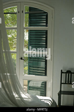 Window Partially Shut closed window with mosquito net and interior decoration of glass and ...