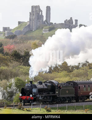 A 1920s Southern Railway 'U' class steam locomotive No. 31806, known as 'Mogul', hauls an excursion train between Dorchester and Weymouth in Dorset, as it makes it's way from Yeovil to Swanage. Stock Photo