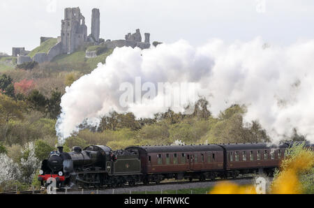 A 1920s Southern Railway 'U' class steam locomotive No. 31806, known as 'Mogul', hauls an excursion train between Dorchester and Weymouth in Dorset, as it makes it's way from Yeovil to Swanage. Stock Photo