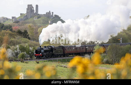 A 1920s Southern Railway 'U' class steam locomotive No. 31806, known as 'Mogul', hauls an excursion train between Dorchester and Weymouth in Dorset, as it makes it's way from Yeovil to Swanage. Stock Photo