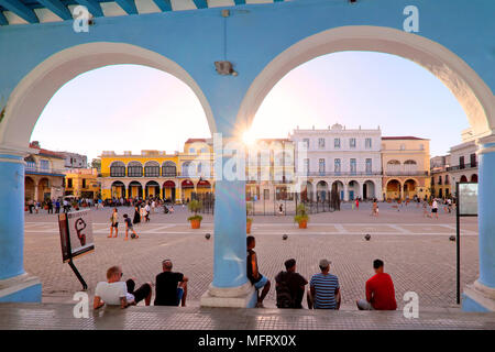 Sun setting over the colorful colonial buildings on Plaza Vieja / Old Square, Havana, Cuba Stock Photo