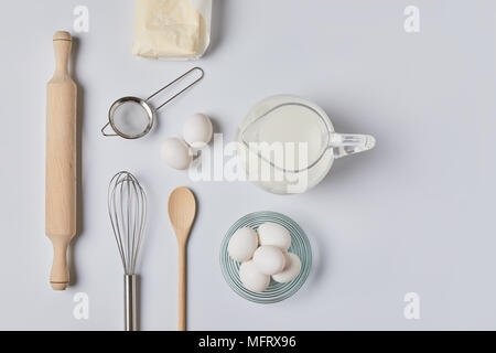 top view of eggs and milk on white table Stock Photo