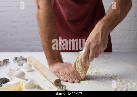 cropped image of chef preparing dough in kitchen Stock Photo